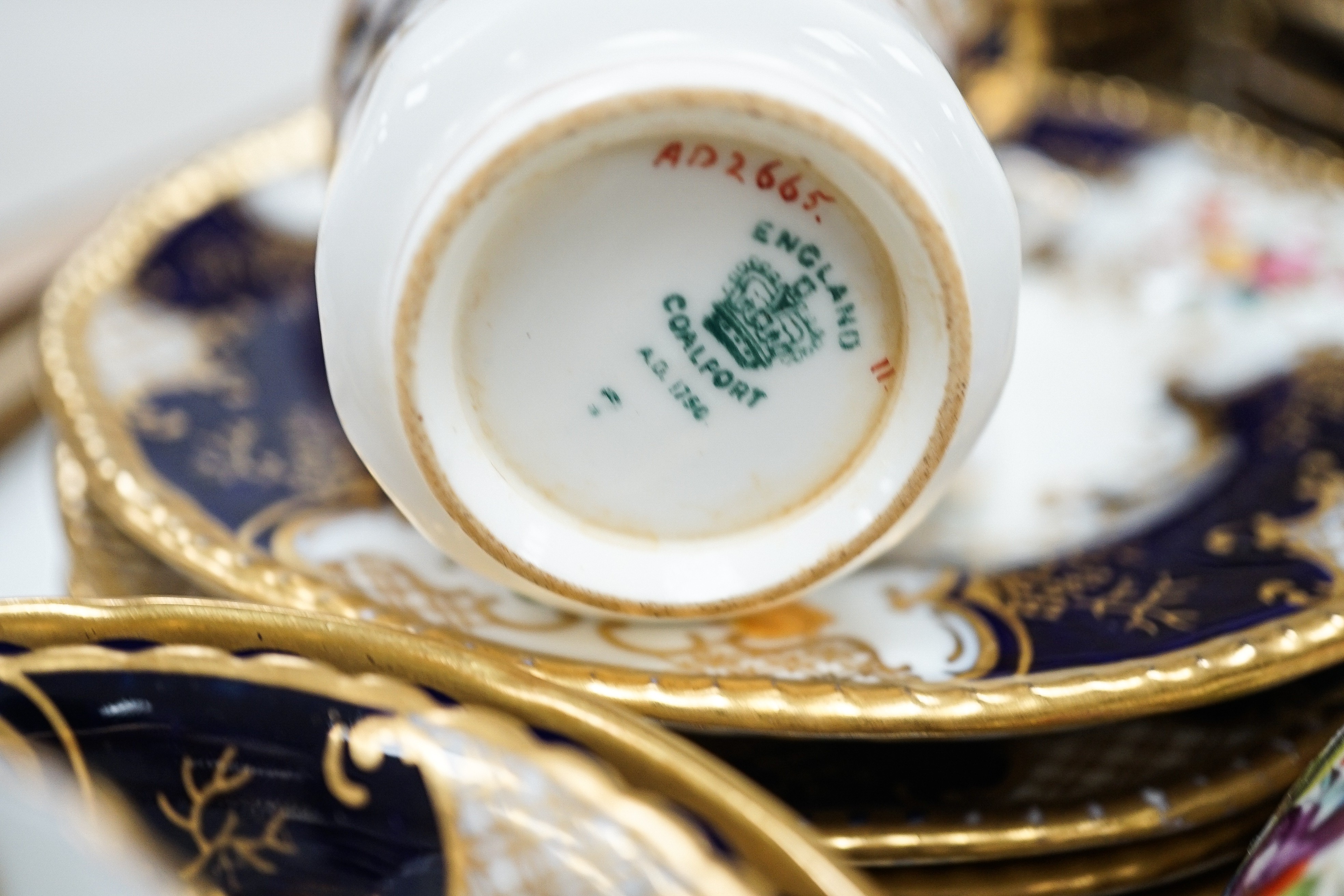 A large set of Coalport blue ground tea and coffee service and similar green ground tea wares